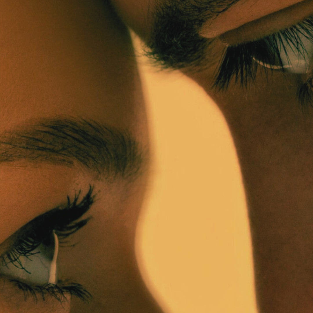 Close-up of a woman's eyes, soft and contemplative, symbolising the search for one's relationship pattern